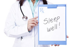 Doctor holding sign that says sleep well